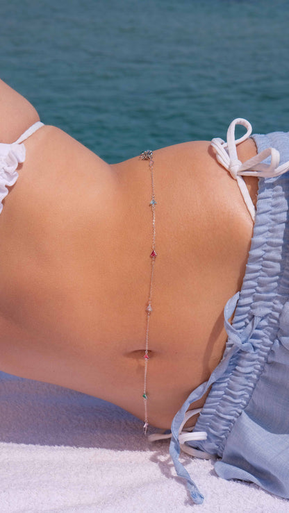 Minimalist silver waist chain with triangle zirconia stones, a modern take on belly chain and silver jewelry trends.