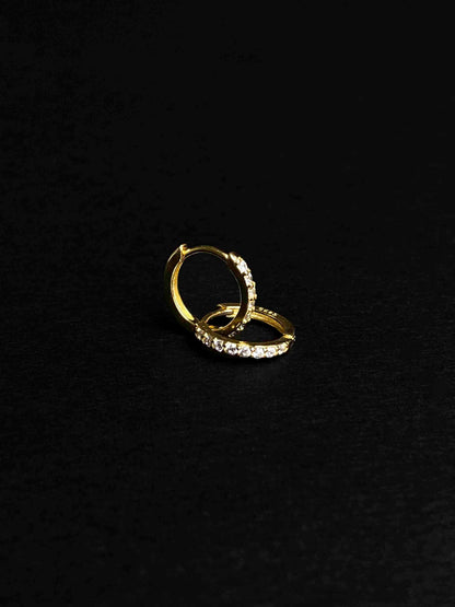 Gold-plated hoop earrings with zirconia stones.