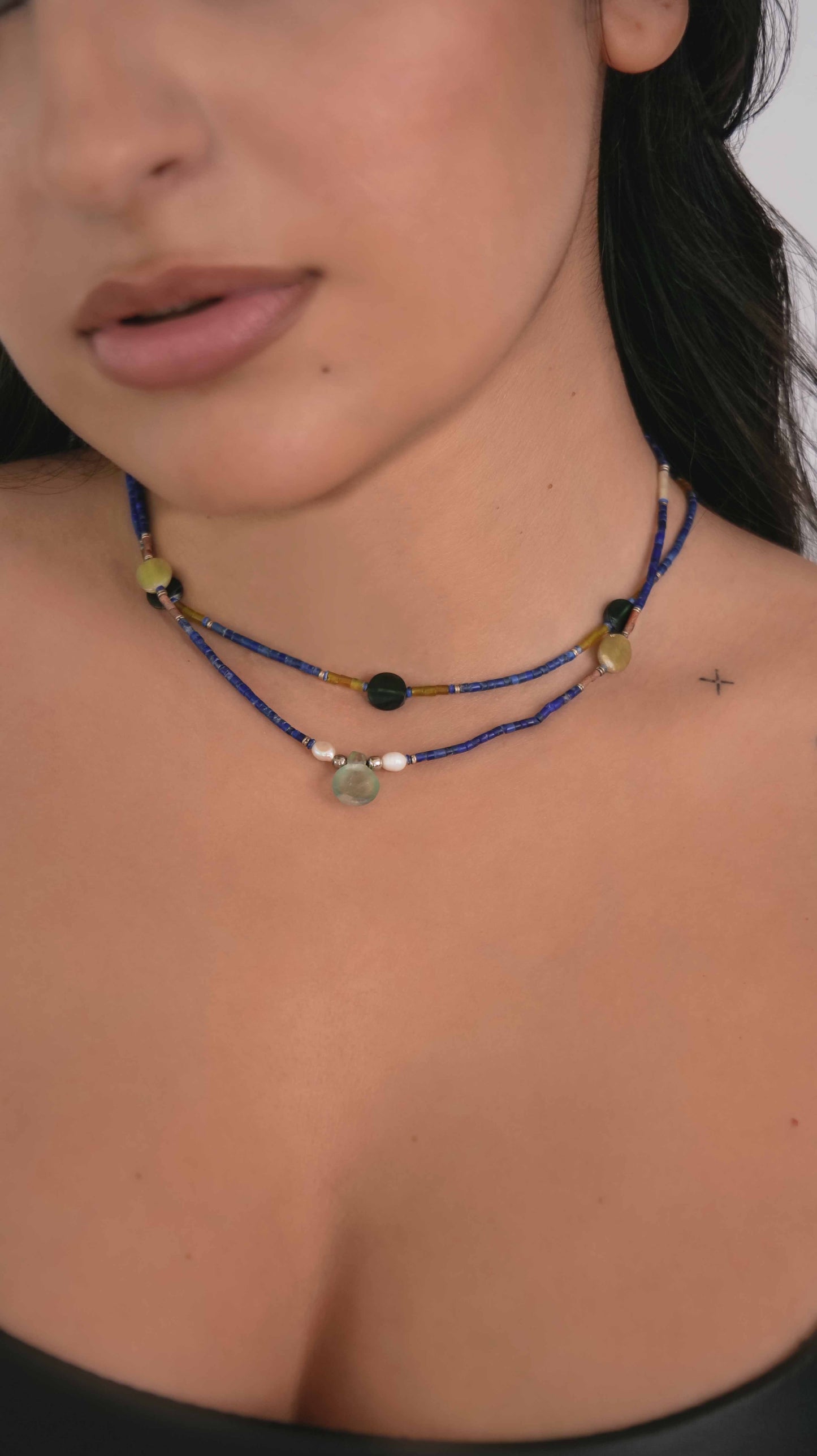 Handcrafted vintage necklaces that feature green quartz, pearls, granite, black tourmaline, and lapis lazuli stones with 925 sterling silver balls and clasp.