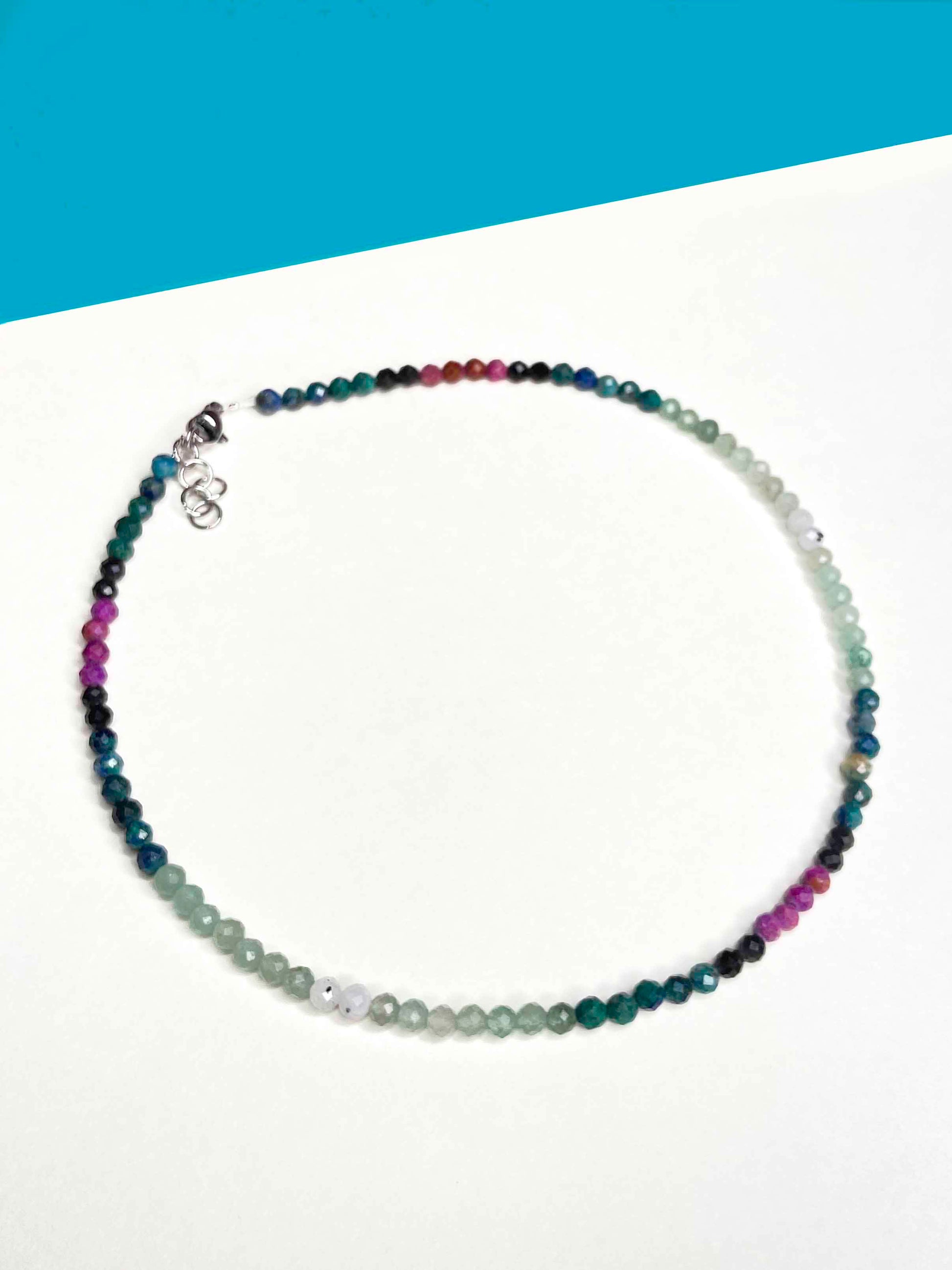 Handmade beaded green and purple mixed gemstone necklace with a sterling silver clasp.