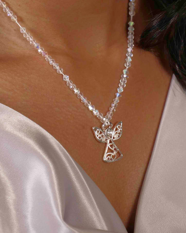 Handmade clear crystal beaded necklace with angel charm. 