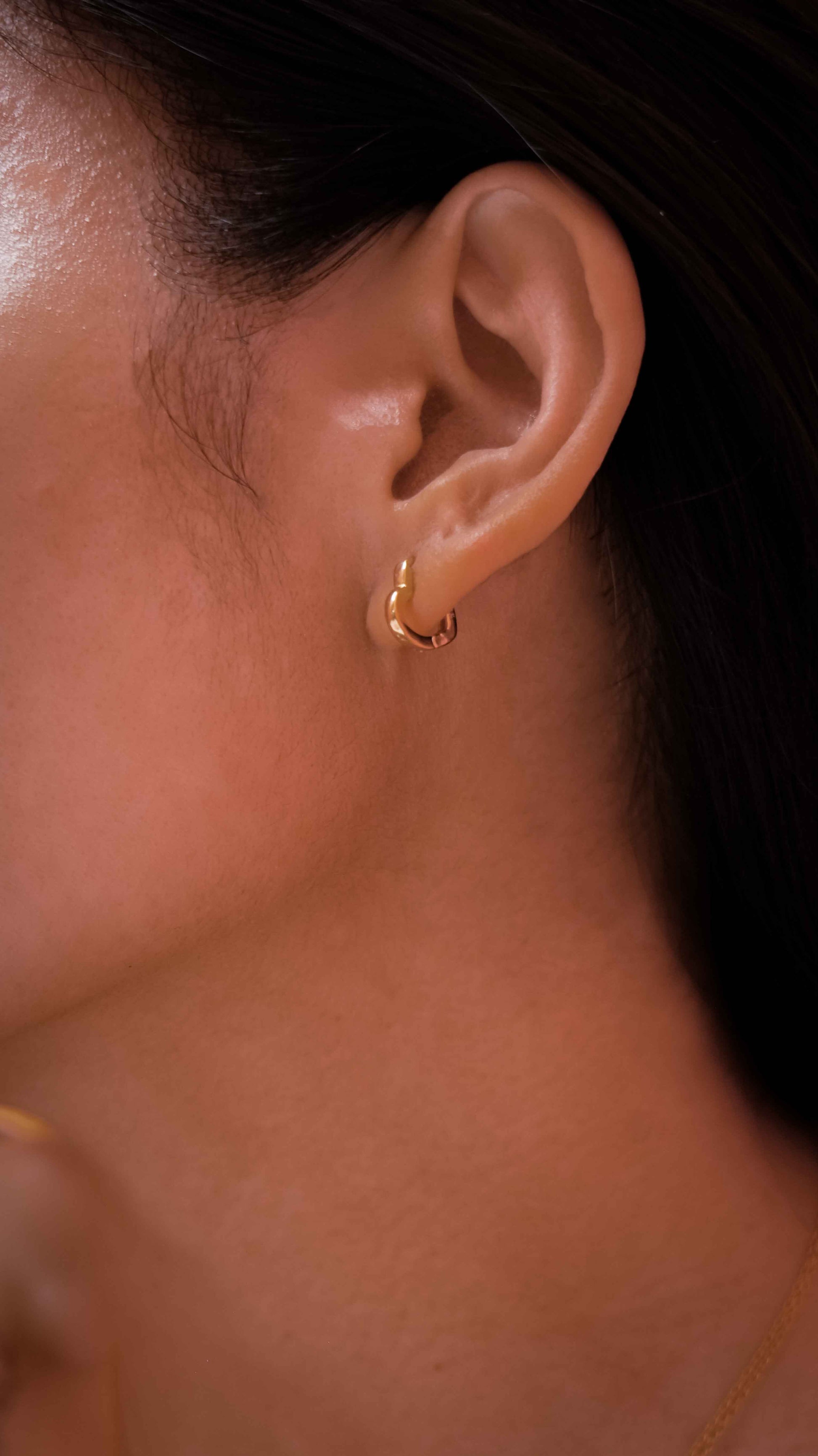 Gold-plated 925 sterling silver heart hoop earrings.