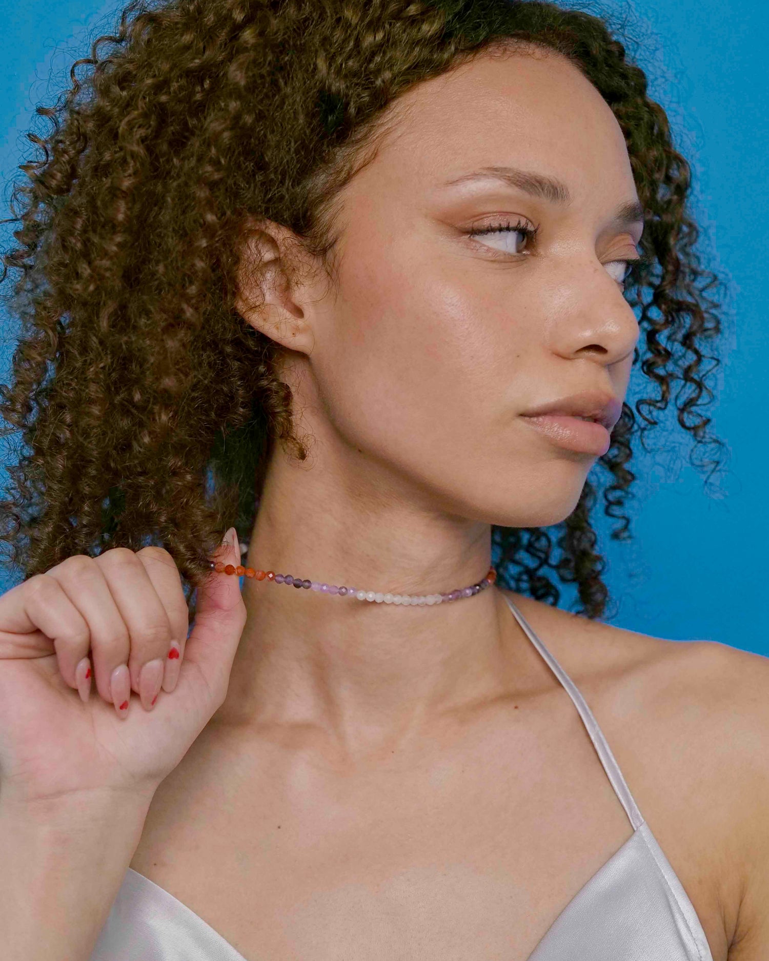 Handmade purple and orange mixed gemstone bead necklace with a sterling silver clasp.