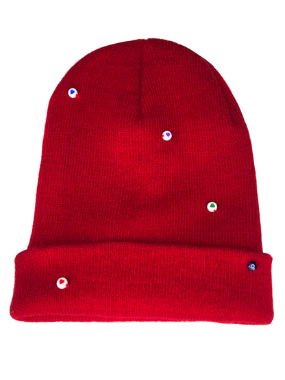 A red wool knit beanie decorated with both multicolor circle heart beads, and an evil eye charm.