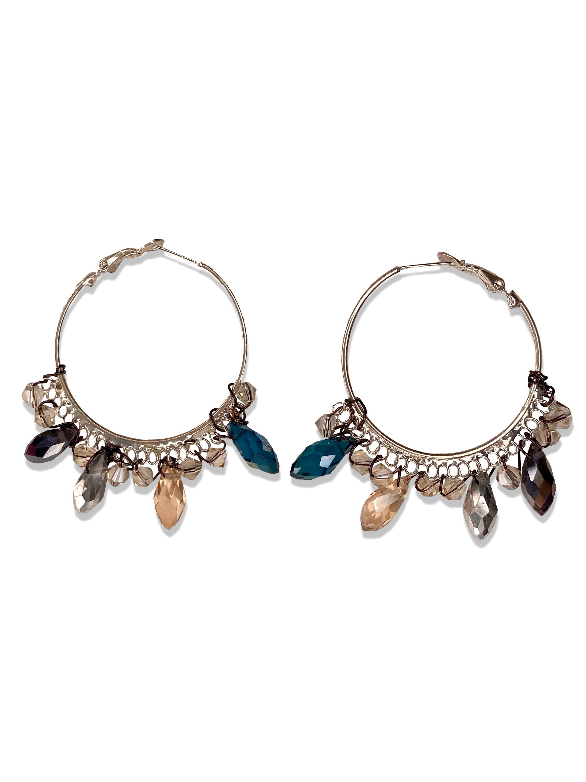 Handmade blue and clear crystal beaded hoop earrings.