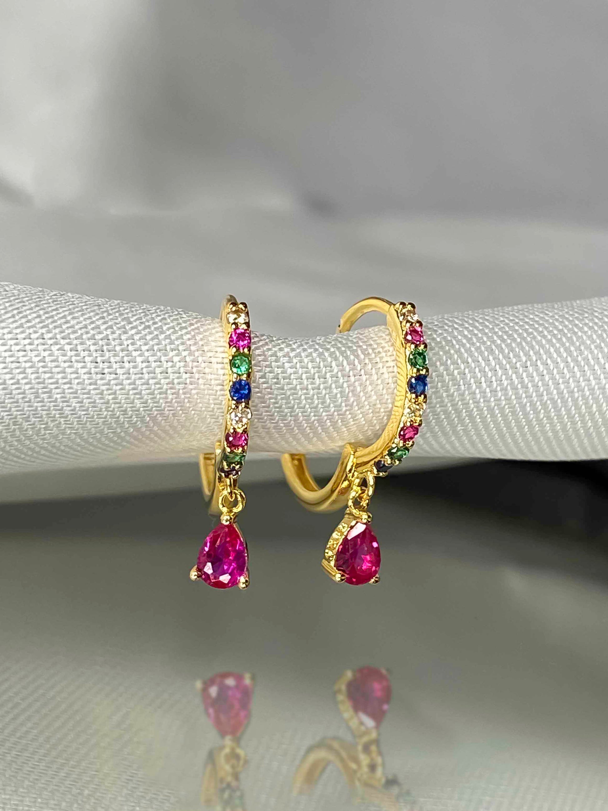  925 gold-plated sterling silver huggie hoop earrings with multicolored zirconia stones. 