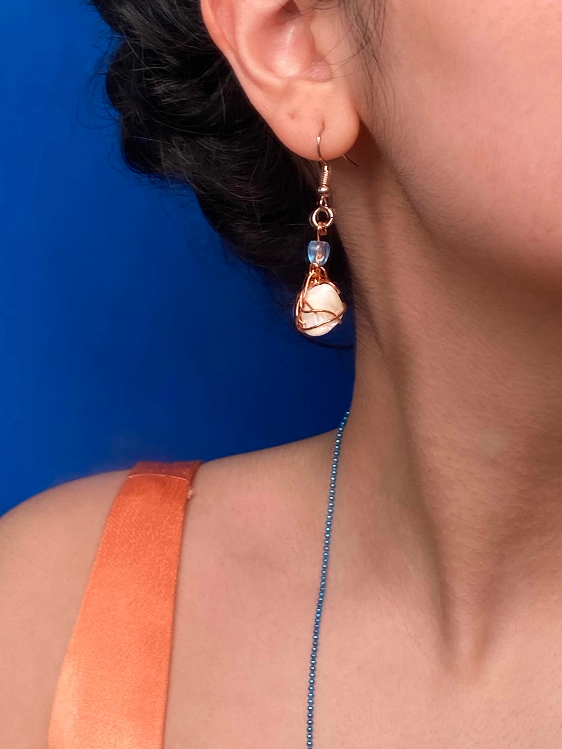 Handmade copper wire wrapped freshwater pearl earrings.