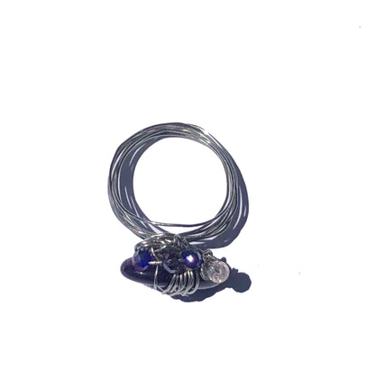 handmade blue and clear crystal beaded silver wire wrapped ring with a tourmaline centerpiece. 