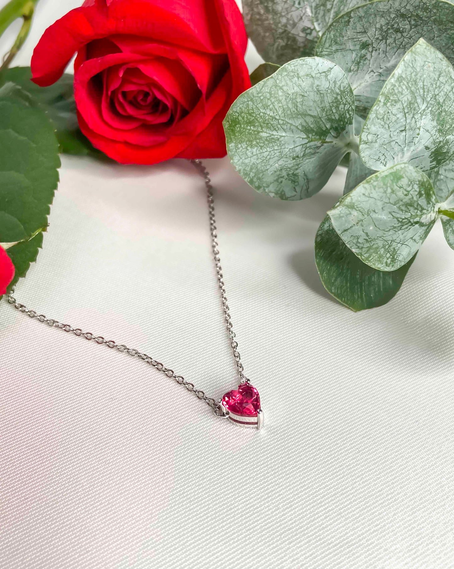 925 sterling silver chain necklace with a heart shaped rubellite gemstone.