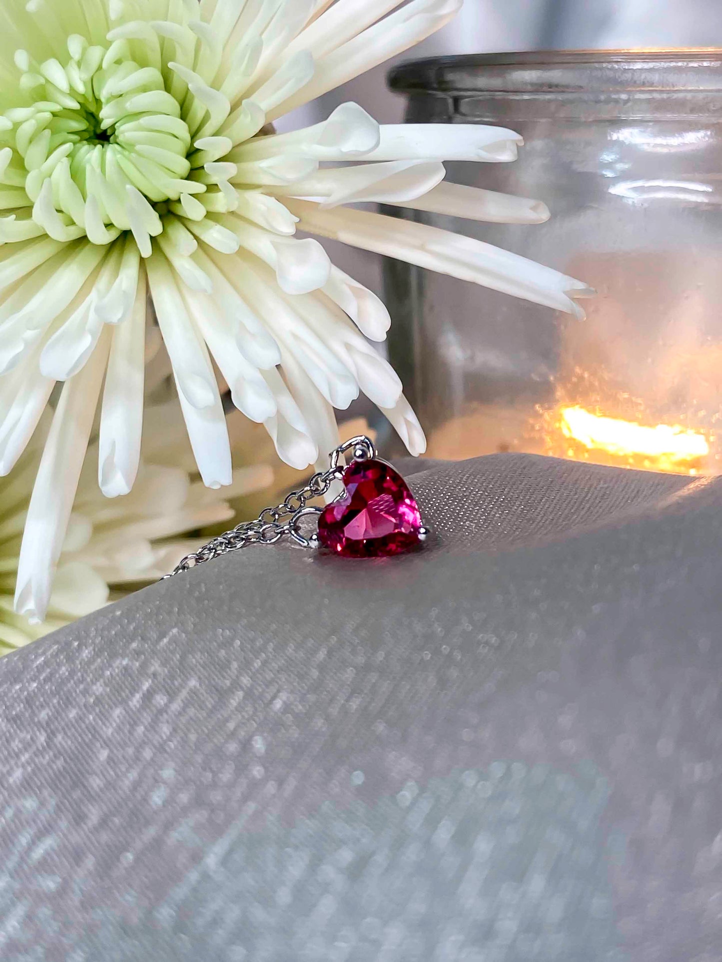 925 sterling silver chain necklace with a heart shaped rubellite gemstone.