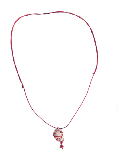 handcrafted red and silver wire wrapped seashell pendant with clear and red crystal beads and adjustable knot ties.