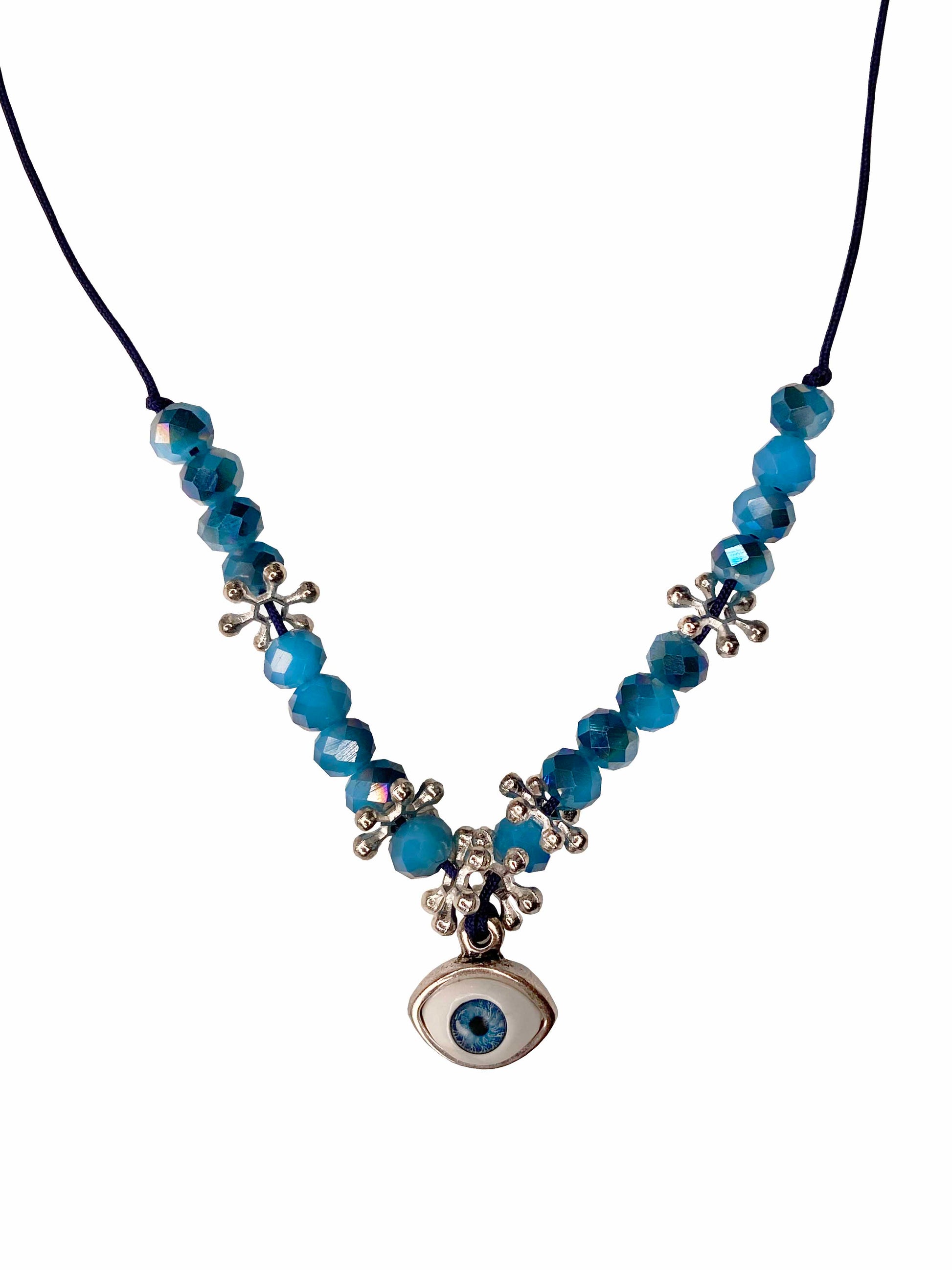 Handcrafted blue crystal and silver flower beaded necklace with silver backed evil eye charm.