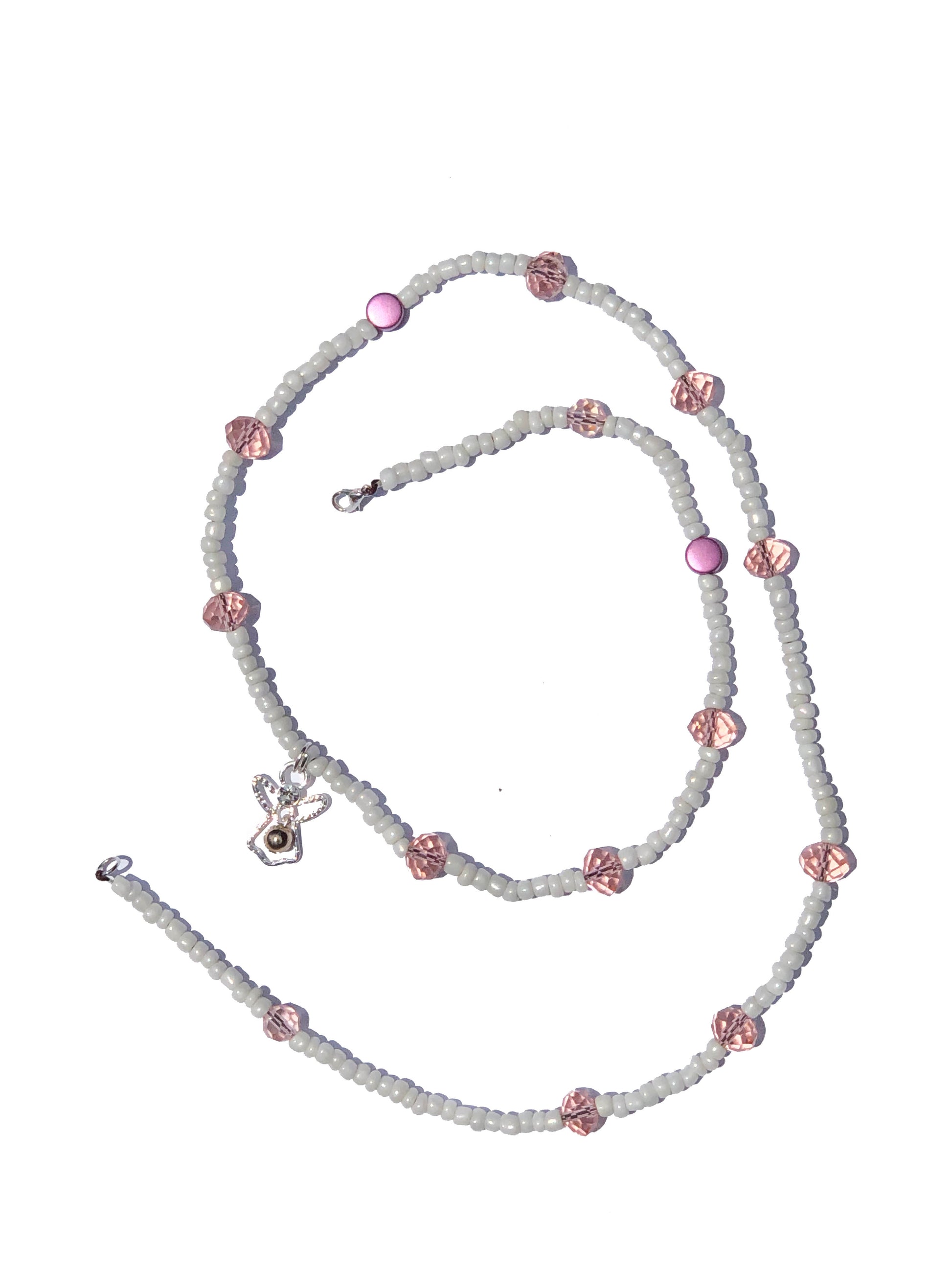 White glass beads with large light pink crystal and circle beads, handcrafted into a belly chain with silver angel charm