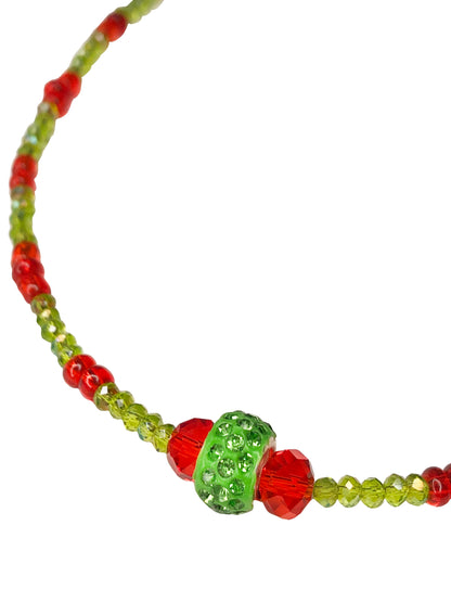 Handcrafted red and green crystal beaded necklace with rhinestone charm at its center.