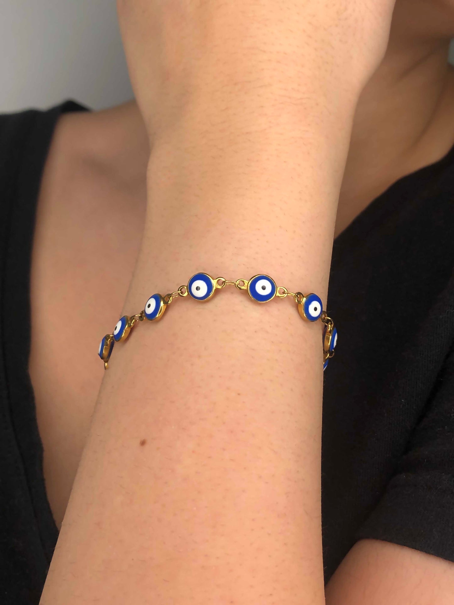 Handmade golden blue evil eye charm chain bracelet.