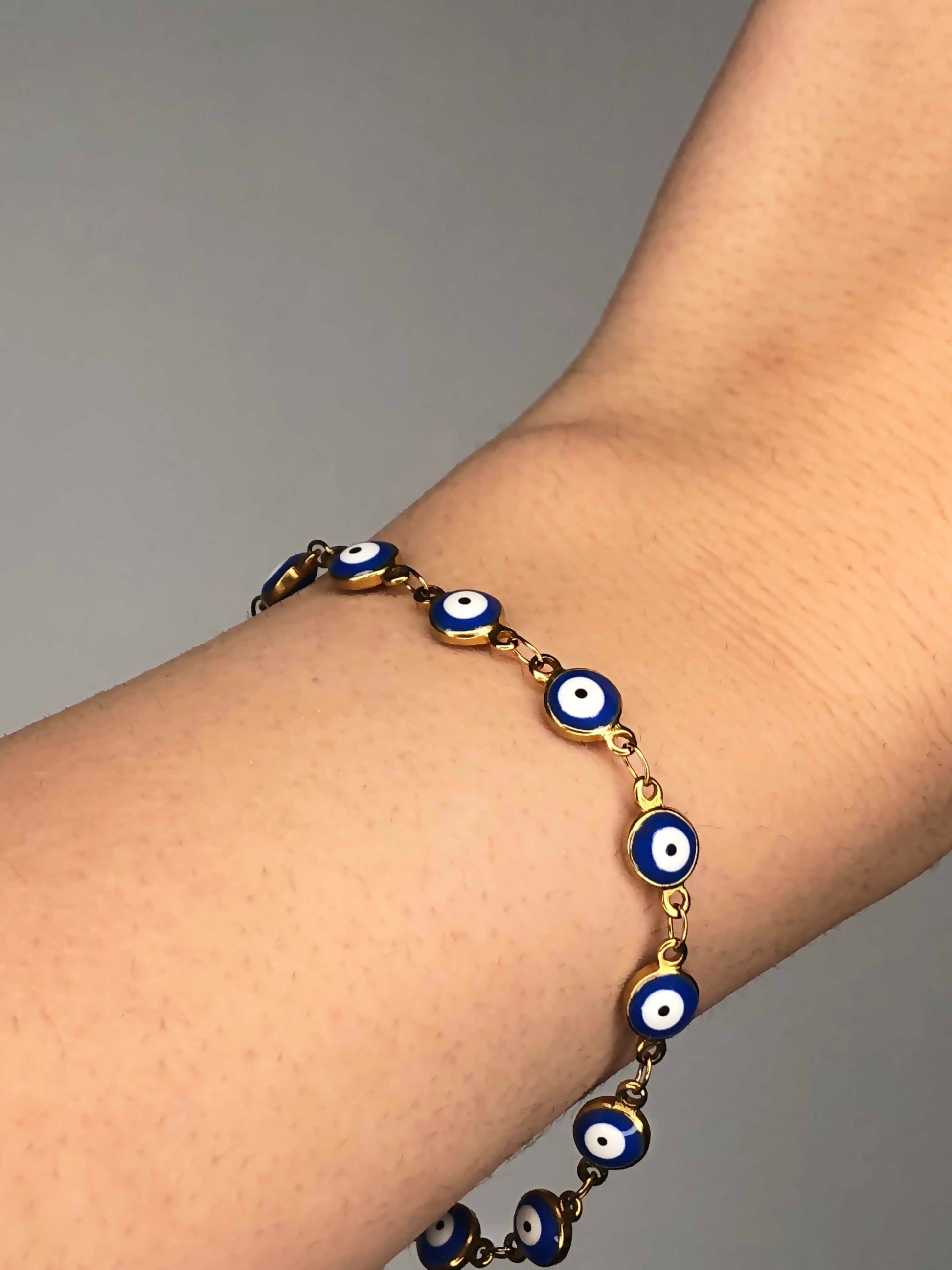 Handmade golden blue evil eye charm chain bracelet.