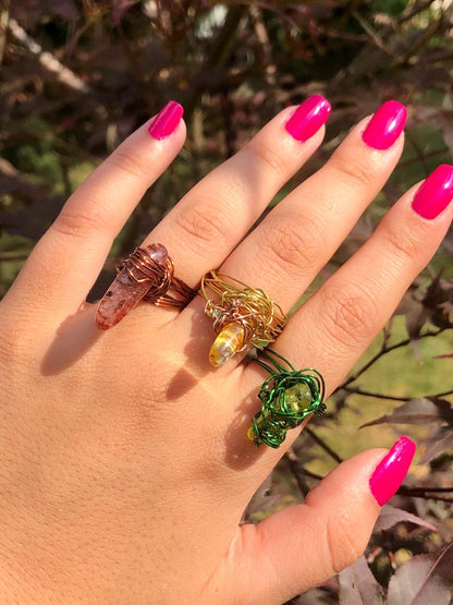 handcrafted wire wrapped ring made using brown wires and a tourmaline gemstone 