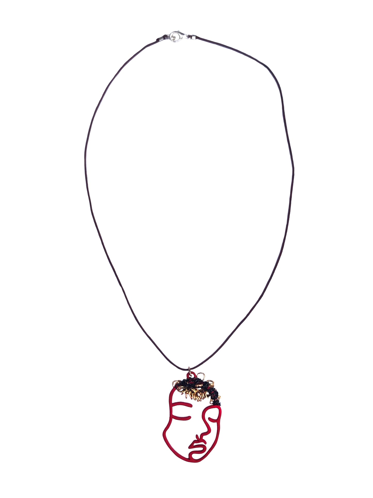 Pendant necklace made using a red hollowed-out face charm wire wrapped & beaded with small golden rings.
