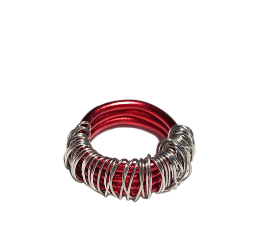 handcrafted ring made using a wire wrapped thick red base with metallic wire detailing 