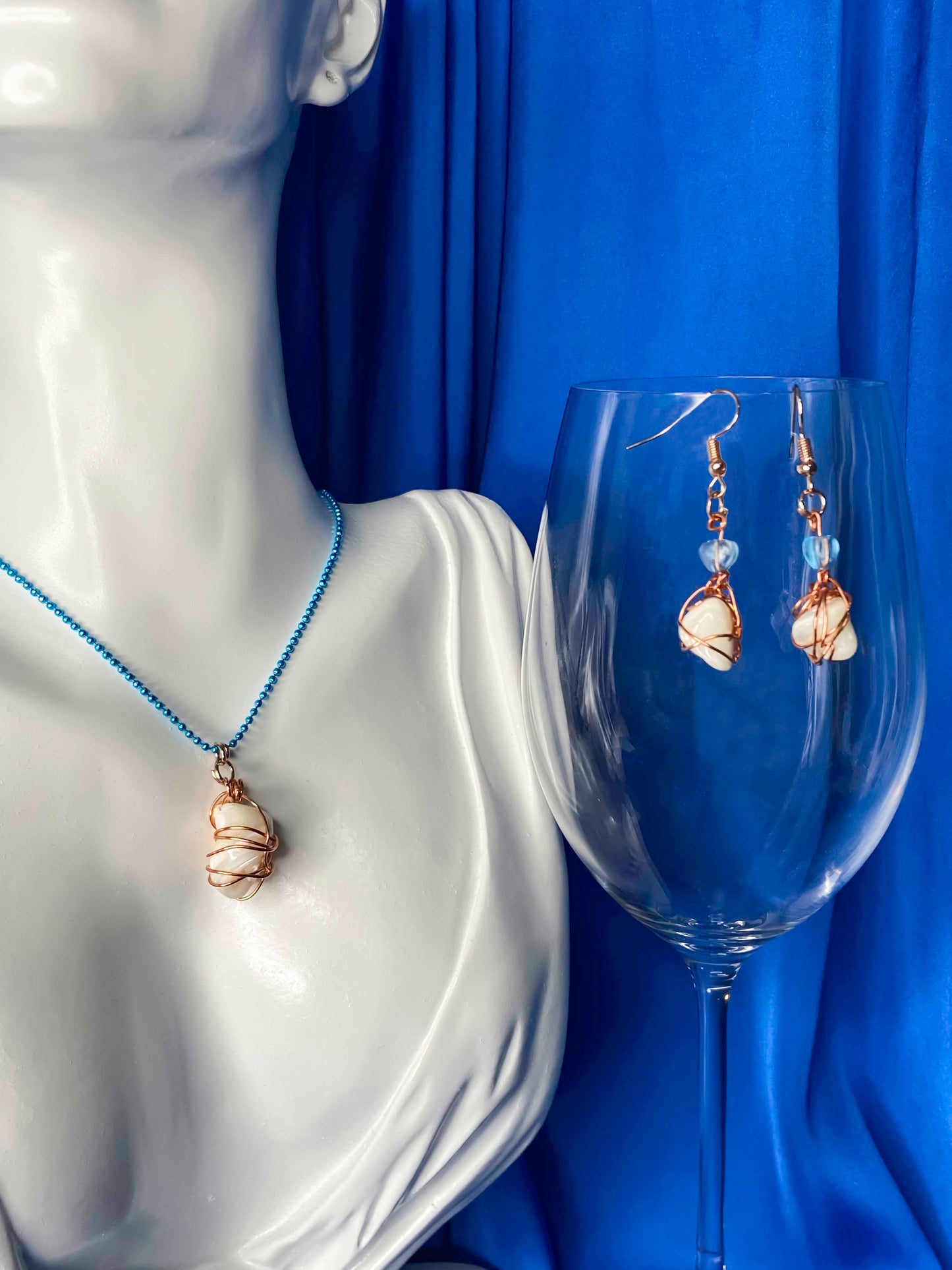 Handmade copper wire wrapped large freshwater pearl necklace and earrings set.
