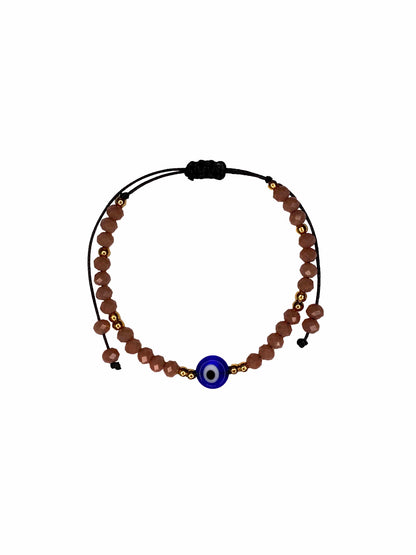 Handmade pink crystal beaded nazar amulet bracelet with sliding knot ties.