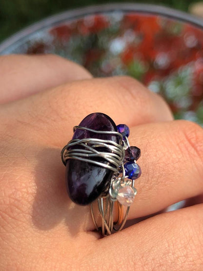 handmade blue and clear crystal beaded silver wire wrapped ring with a tourmaline centerpiece. 