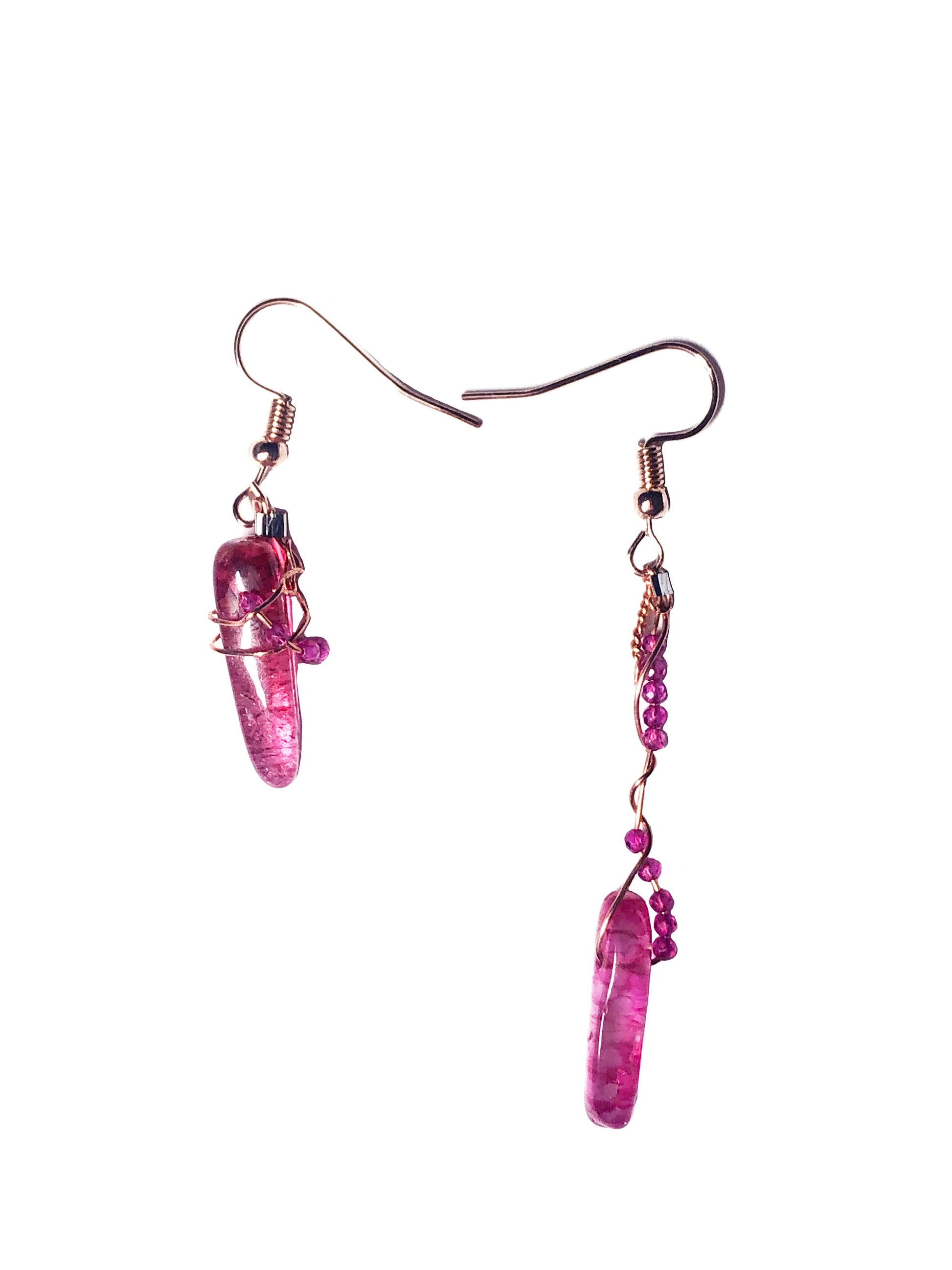Handcrafted asymmetrical pink crystal beads and a pink tourmaline stone wire wrapped earrings. 