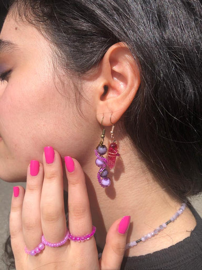 Beaded pink glass wire wrapped disco ball purple and black beaded earrings. 