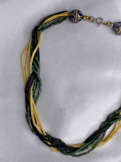 Vintage handmade beaded necklace made using granite stone beads, silver, and lapis lazuli.