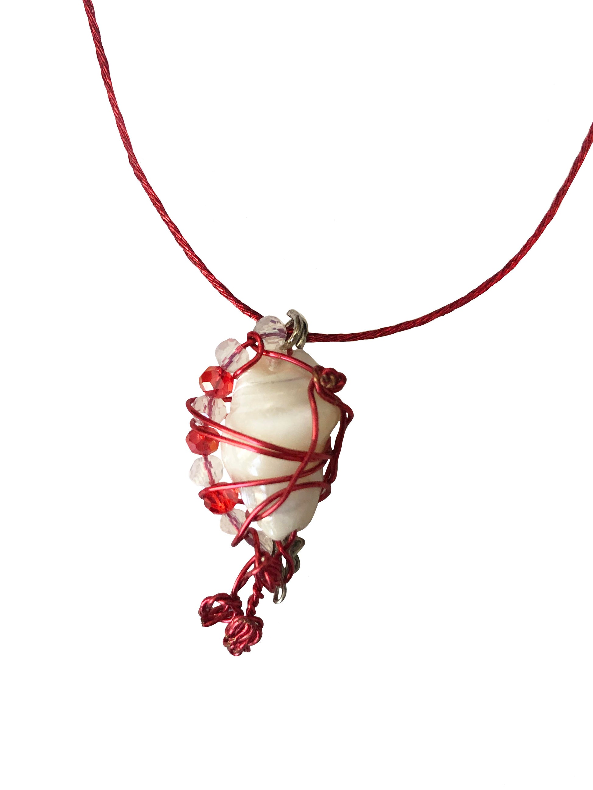 handcrafted red and silver wire wrapped seashell pendant with clear and red crystal beads and adjustable knot ties.