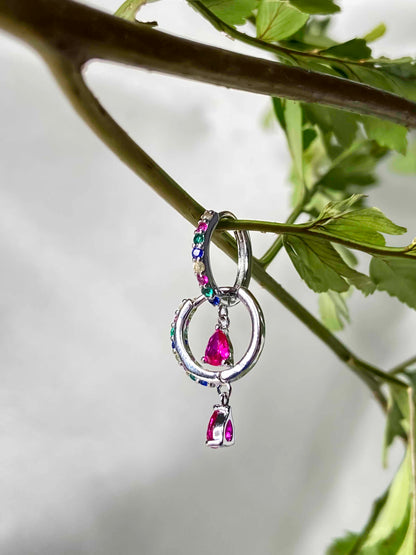  925 sterling silver huggie hoop earrings with multicolored zirconia stones. 