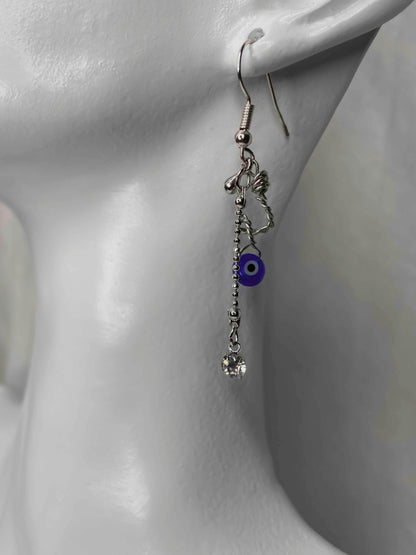 Handmade silver wire wrapped evil eye dangle drop earrings.