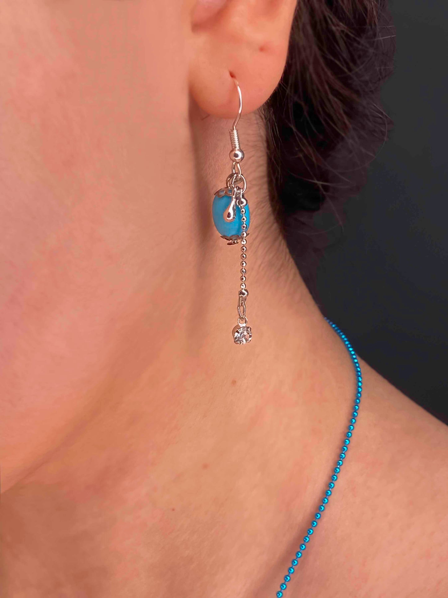 Handmade pair of turquoise stone and sterling silver dangle drop earrings. 