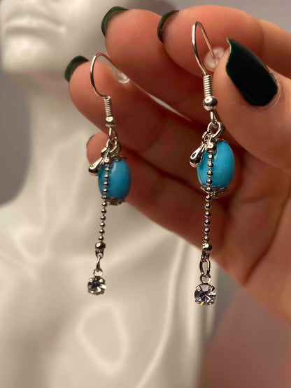 Handmade pair of turquoise stone and sterling silver dangle drop earrings. 