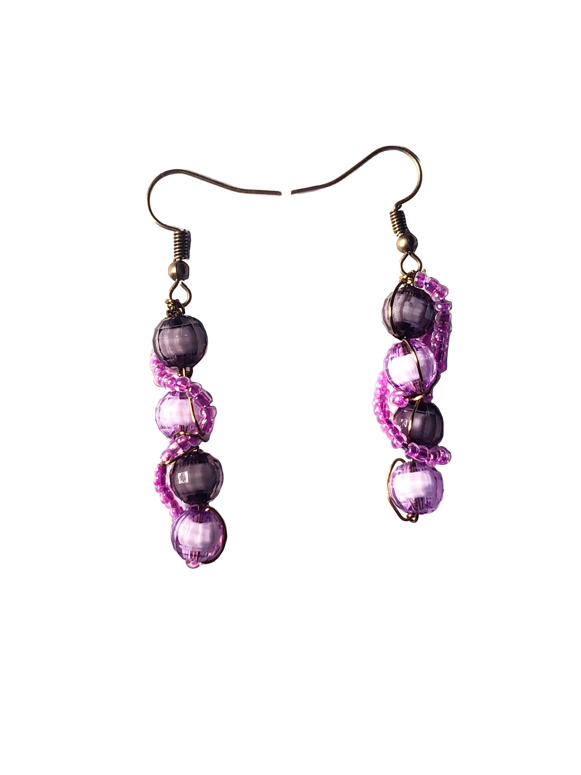 Beaded pink glass wire wrapped disco ball purple and black beaded earrings. 