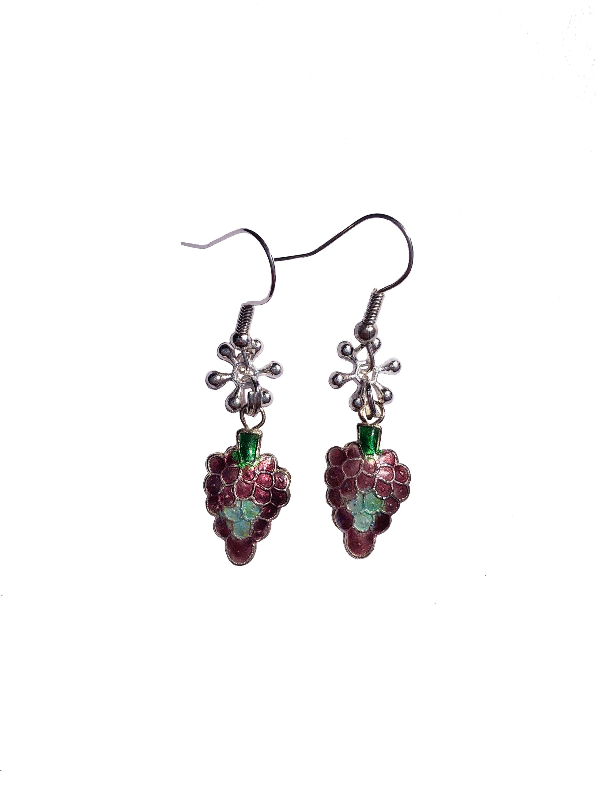a pair of handmade purple grape charm earrings with flower charms.