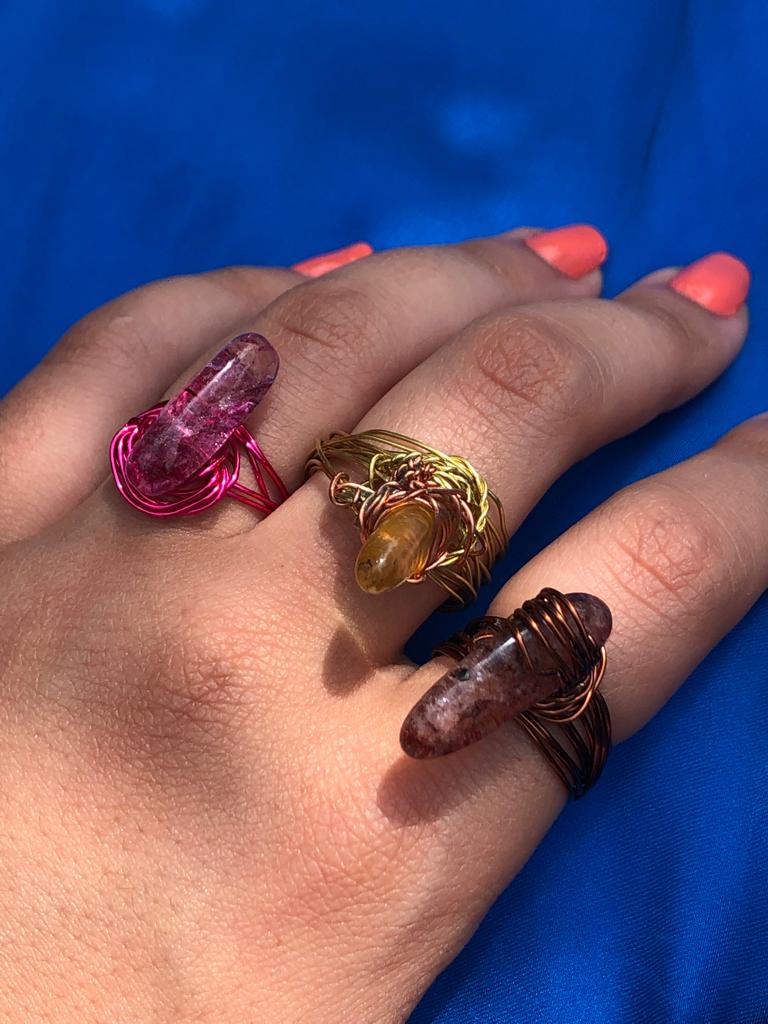 handcrafted wire wrapped ring made using brown wires and a tourmaline gemstone 